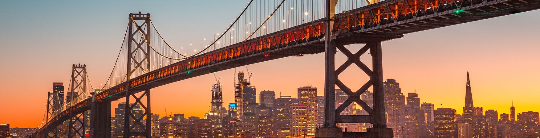 Golden Gate Bridge at sunset with San Francisco skyline, symbolizing the Bay Area where personal injury attorney John Roach, Esq., fights for accident victims' rights.